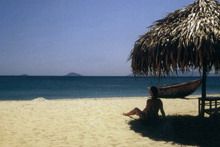Travelers with Hoi An ancient town and beach
