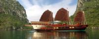Travelers with Halong Bay on Red Dragon Junk