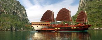 Travelers with Halong Bay on Red Dragon Junk