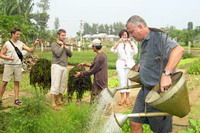 TOURISTS IN Tra Que Vegetable Village by Bicycle Tour