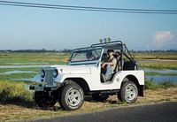 TOURISTS IN Tra Que Vegetable Village by Jeep Tour