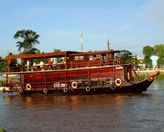 TOURISTS IN Mien Tay sampan