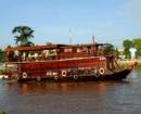 TOURISTS IN Mien Tay sampan