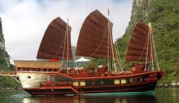 Travelers with Halong  Bay on Red Dragon Junk