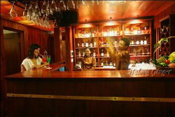 Relax with a cocktail at bar in Halong Ginger Junk, Halong Bay, Vietnam private tours