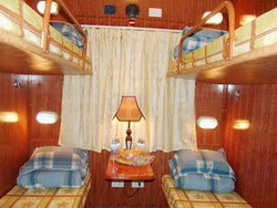 Soft-berth cabin in Pumpkin train, a tourist train from Hanoi to Lao Cai, Vietnam